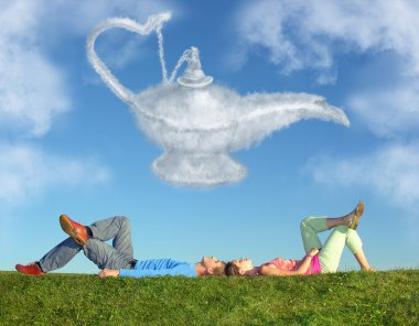 Lying couple on grass and dream alladin lamp cloud collage clipart