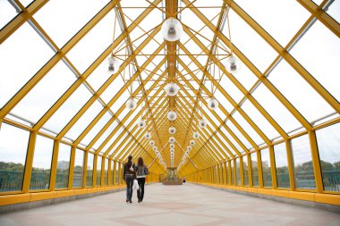 Pedestrians on pedestrian bridge clipart