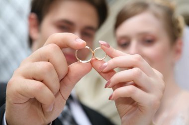 Wedding couple with rings clipart