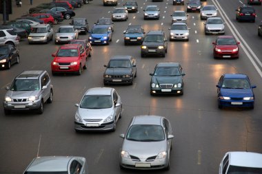 Cars on evening road clipart