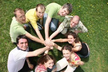 Eight friends have combined hands together clipart