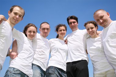 Group of friends in white T-shorts are in a circle clipart