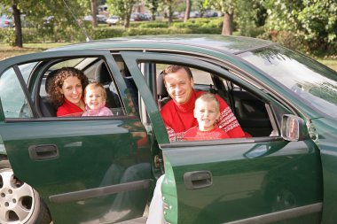 Family sitting in car 2 clipart