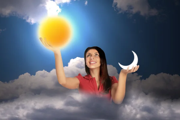 Vrouw in hemel met wolken houdt maan en de zon in handen, collage — Stockfoto