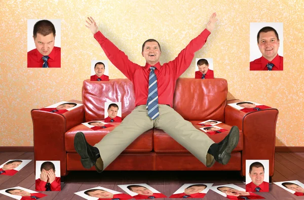 Man on the leather red sofa with the photographs, collage — Stock Photo, Image