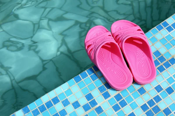 stock image Beach slippers on pool side