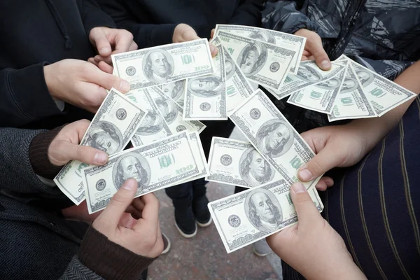 stock image Teens staying with dollars