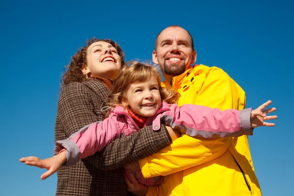 Little girl with mum and daddy — Stock Photo, Image