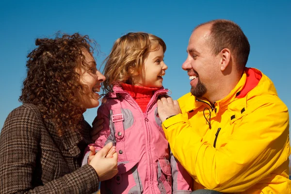 Little girl with mum and daddy — Stock Photo, Image