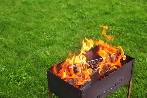 Brazier on lawn — Stock Photo, Image