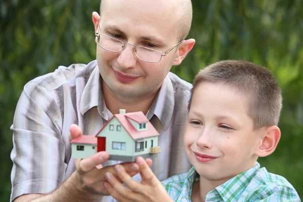 Wendy house in hands — Stock Photo, Image