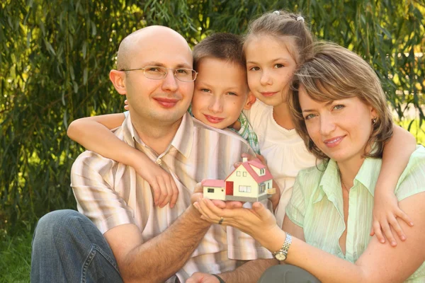 Wendy house in hands — Stock Photo, Image