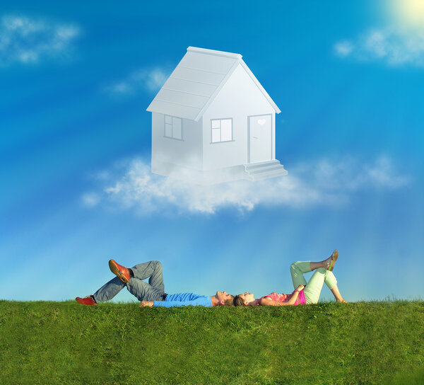 Lying couple on grass and dream house collage