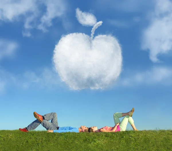 Lying couple on grass and dream apple collage — Stock Photo, Image