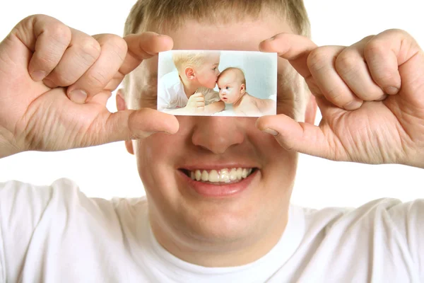 Man with card of kids on eyes, collage — Stock Photo, Image