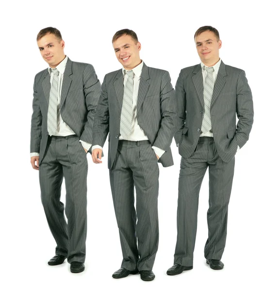 Três empresários alegres de terno em pé sobre fundo branco, co — Fotografia de Stock
