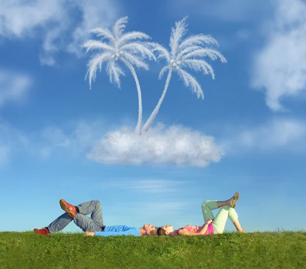 Lying couple on grass and dream island collage — Stock Photo, Image