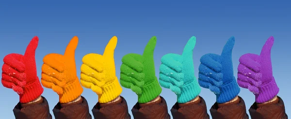 Hands in rainbow gloves show gesture ok, collage — Stock Photo, Image