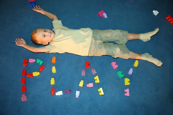 Boy laying on floor — Stock Photo, Image