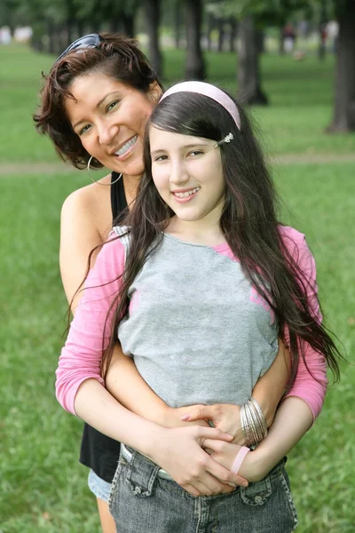 Mother and daughter they stand in the parknd — Stock Photo, Image