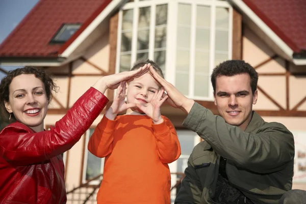Young family and house — Stock Photo, Image