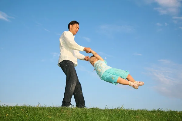 Father rotates daughter — Stock Photo, Image