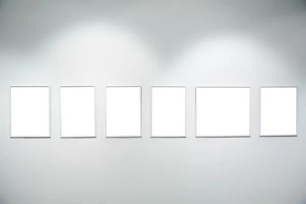 Frames on white wall — Stock Photo, Image