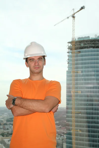 Worker in the helmet on the building — Stock Photo, Image