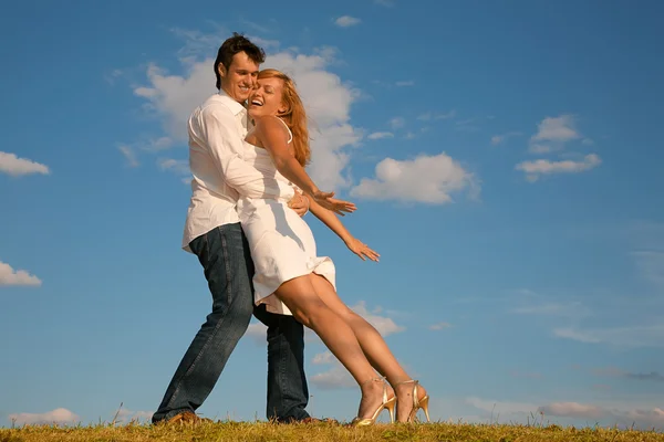 Man holds the woman on the meadow — Stock Photo, Image
