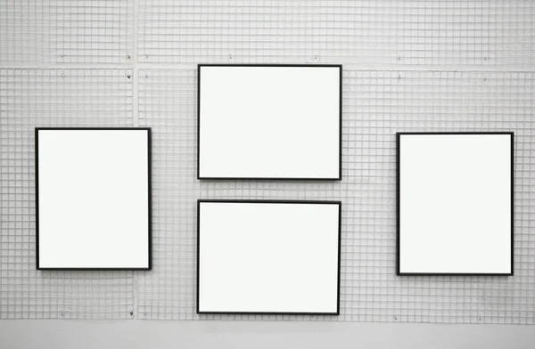 Black frames on thewhite wall — Stock Photo, Image