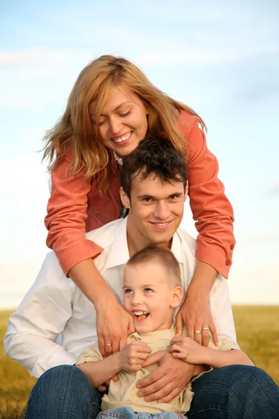 Mom embraces husband with the son — Stock Photo, Image