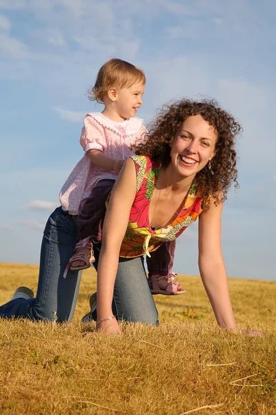 Child sits on the mother — Stock Photo, Image