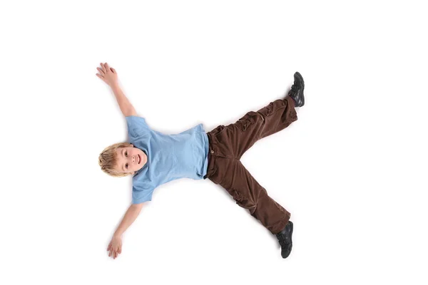 Лежачий мальчик — стоковое фото