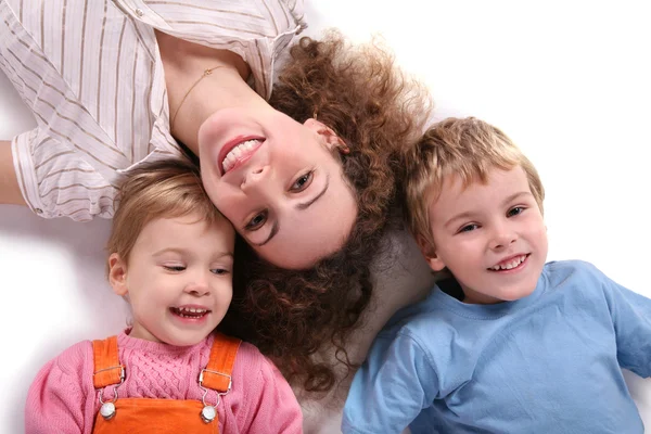 Mother and children lying — Stock Photo, Image
