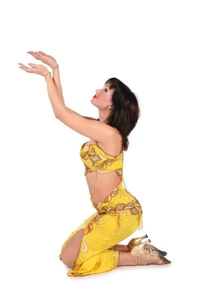 Yellow bellydancer on knees — Stock Photo, Image