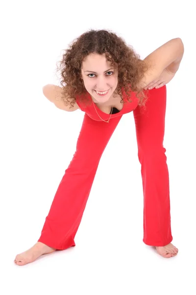 Stretching girl in red — Stock Photo, Image