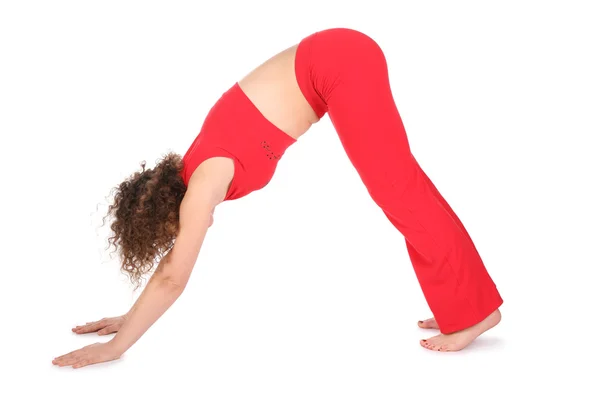 Girl in red doing yoga exercise — Stock Photo, Image