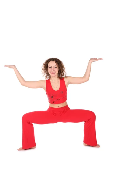 Chica en rojo, un ejercicio de yoga más —  Fotos de Stock