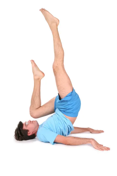 Homem de ioga no chão mentiras — Fotografia de Stock