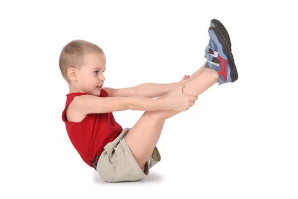 Йога-мальчик с поднятыми ногами — стоковое фото
