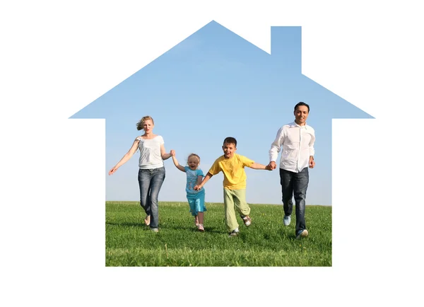 Family of four running in dream house — Stock Photo, Image