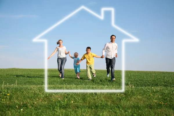 Family of four in dream house — Stock Photo, Image