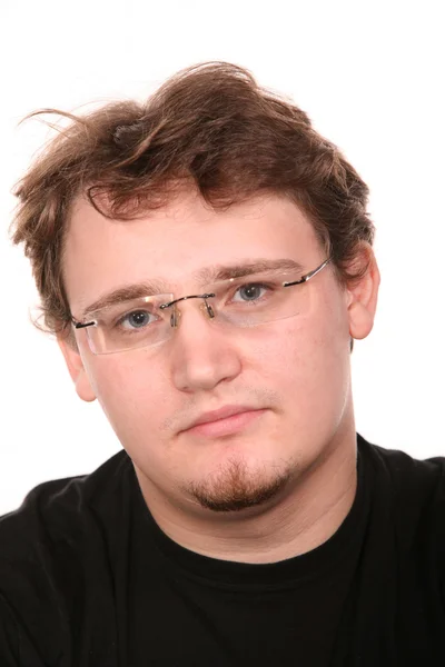Portret van een jonge man in een bril — Stockfoto