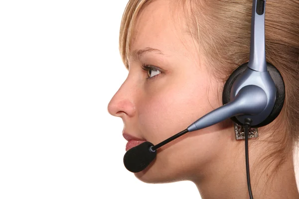 Profile of young woman in headset — Stock Photo, Image