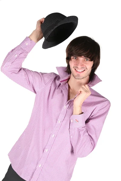 Молодий чоловік з чорним капелюхом в руці на білому — стокове фото