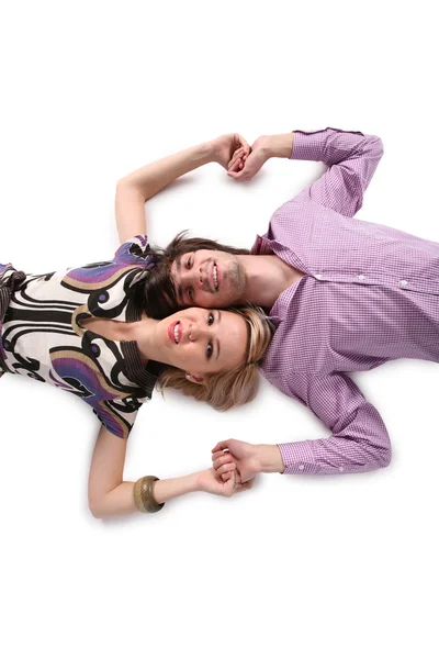 Jongen en meisje liggen op witte 2 — Stockfoto