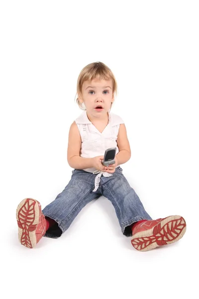 Menina com telefone celular no branco — Fotografia de Stock