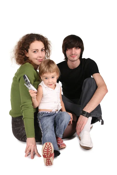 A szülők és a lánya fehér mobiltelefon — Stock Fotó