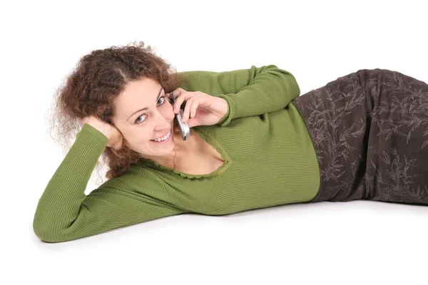 Young woman lie and talk on the cell phones on white — Stock Photo, Image