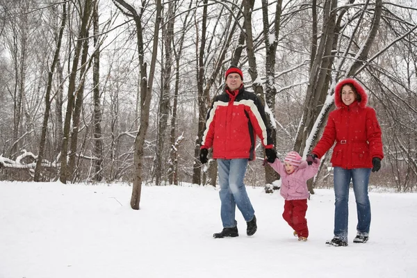 Father and mother walk in park with child at winter — Stock Photo, Image